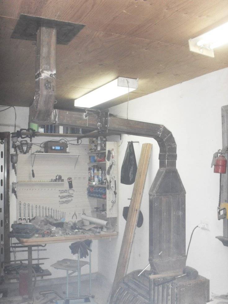 Einen Garagenofen mit eigenen Händen bauen: eine Übersicht der 4 besten hausgemachten Designs