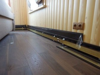 Baseboard opvarmning: funktioner ved installation af en vand og elektrisk varm baseboard